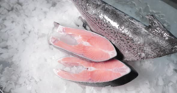 Close-Up Shot Of Sliced Salmon On Crushed Ice - high angle