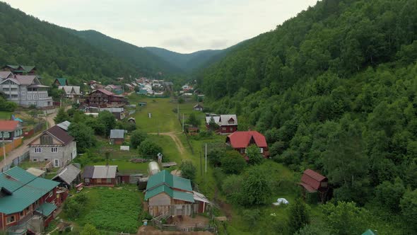 Flight Over the Village Between the Forest Hills