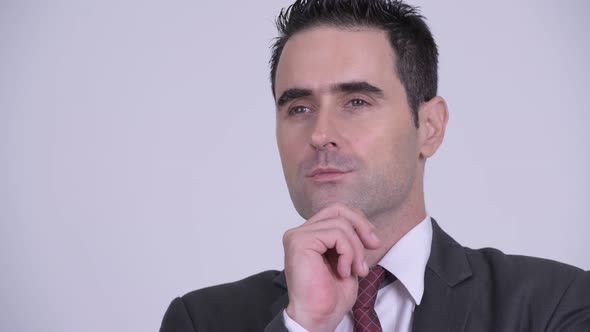 Face of Handsome Businessman Thinking Against White Background
