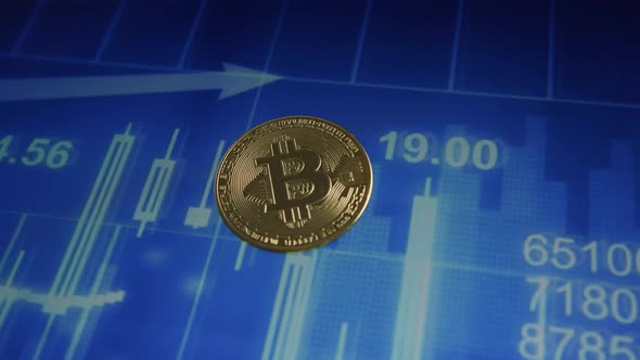 Close up shot golden bitcoin on blue infograhic blurred background