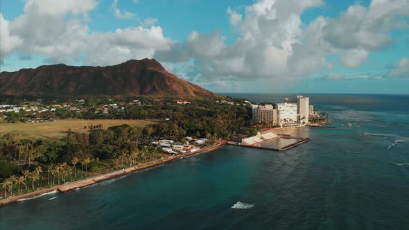 Aerial drone footage of Honolulu, Hawaii. Beautiful real estate, buildings in the city. Palm trees