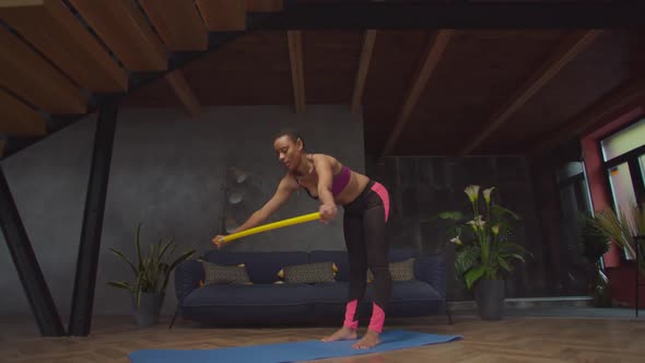 Active Fit Black Woman Working Out with Bar