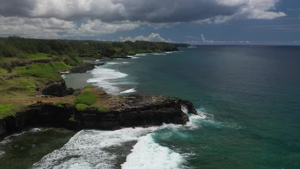 View of the Famous Golden Beach Between Black Volcanic Rocks on the Banks of the Gris-Gris River