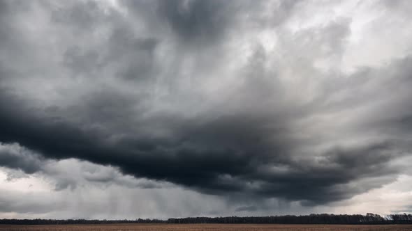 Dark stormy clouds above the fields. time lapse video