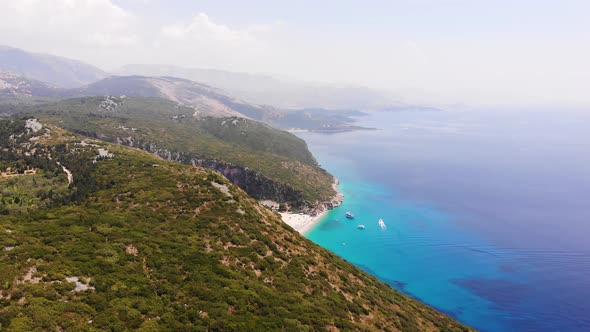 Aerial Drone View of Gjipe Beach and Canyon Dhermi Albania Hidden Paraside with Boats Tourists