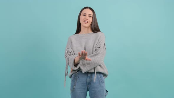 Portrait of a Puzzled Young Woman Expressing Doubting, Hesitating Emotion