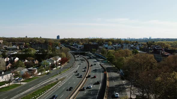 Aerial Views Multiple Lane Highway Leading Towards New York City Skyline Horizon Neighborhood Houses