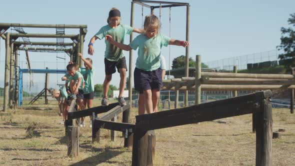 Group of Caucasian children training at boot camp