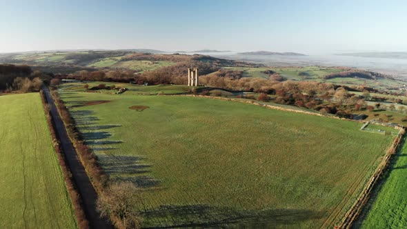 Aerial drone video of Broadway Tower, a famous old building landmark in The Cotswolds Hills, iconic 