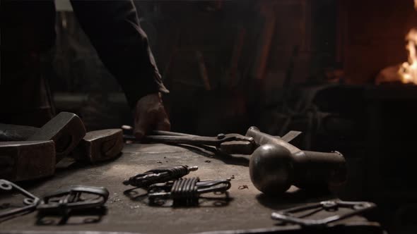 The Blacksmith Takes An Iron Tool