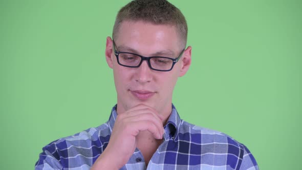 Face of Stressed Young Hipster Man Thinking and Looking Down