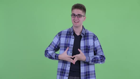 Happy Young Hipster Man Talking and Looking Excited