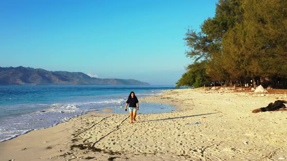 One girl suntans on luxury lagoon beach voyage by clear ocean with white sandy background of the Mal