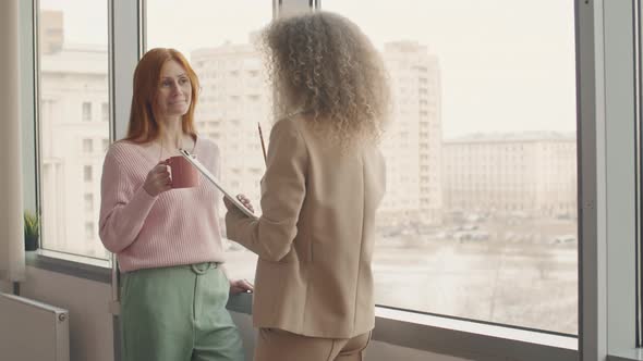 Businesswomen Having Coffee Break