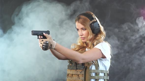 Woman Soldier in Military Uniform Developing Her Shooting Skills alt