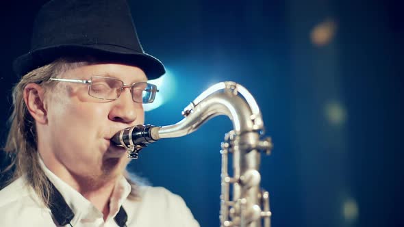 Man Playing the Saxophone on Stage