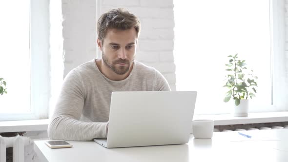 Headache Stressed Businessman Working on Laptop