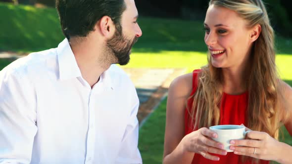 Couple having coffee in outdoor restaurant