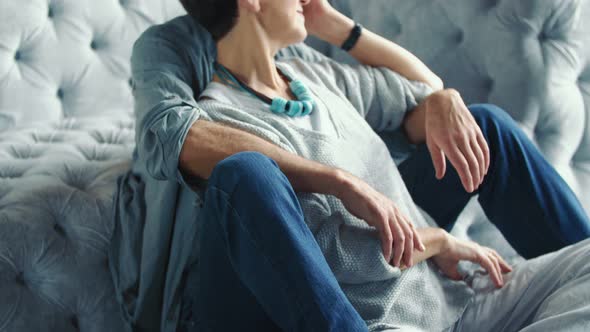 Aged Couple Sitting on the Sofa