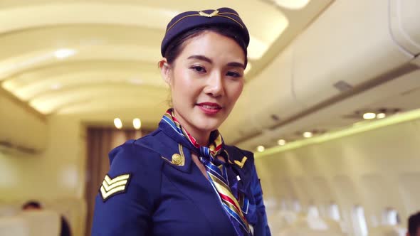 Cabin Crew or Air Hostess Working in Airplane