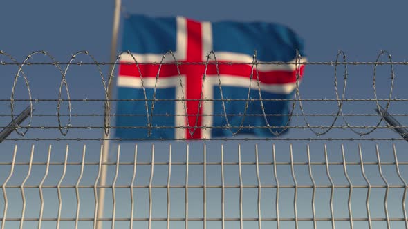 Barbed Wire Against Waving Flag of Iceland