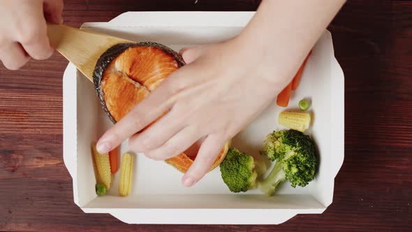 Food Delivery Top View Take Away Meal in Disposable Container on Wooden Table