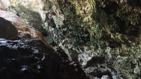 Underground Cave with Stalactite Rock Formations Hanging From Kuza Cave Ceiling