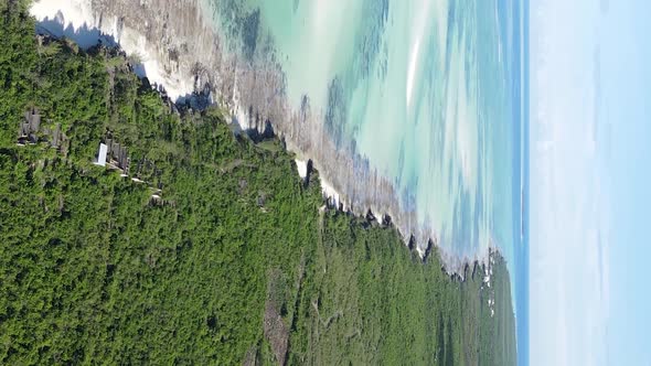 Vertical Video of Low Tide in the Ocean Near the Coast of Zanzibar Tanzania Aerial View