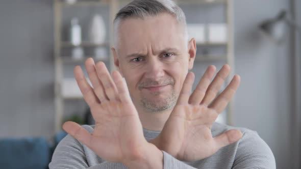 Rejecting Disliking Gesture By Gray Hair Man