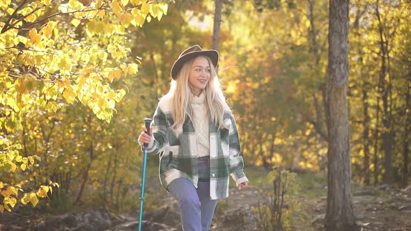 Adorable Caucasian Woman is Posing Near Tree