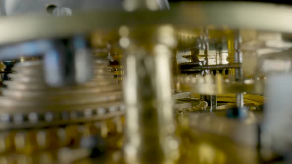 Inside View of Moving Clockwork of Golden Mechanical Clock