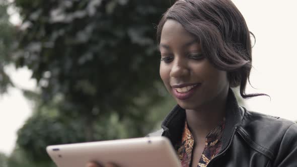 Laughing Young African American Female Girl Holding a Touch Pad Tablet PC Outdoor, Black Student