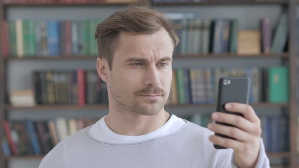 Portrait of Adult Man Busy Using Smartphone