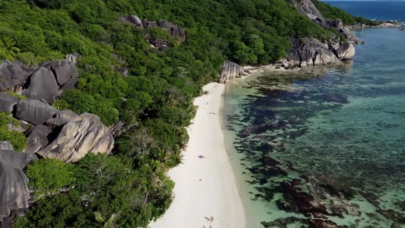 beach with large stones on the island of La Digue