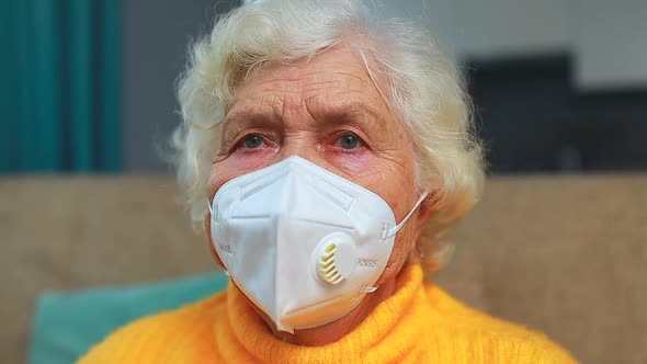 Senior Woman Wearing Face Mask During Corona Virus at Home