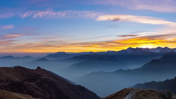 Panorama on the Alps at sunset. Stunning colorful sky, high altitude mountain peaks