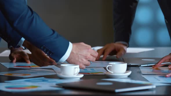 Close up hands of young business people group meeting in office