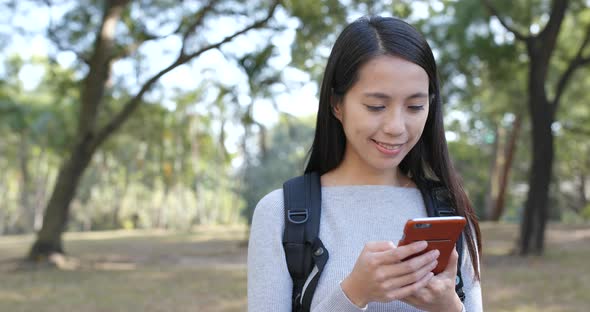 Woman using smart phone at outdoor