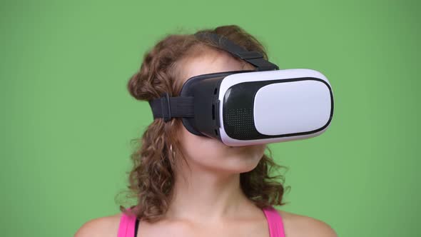 Young Beautiful Woman with Curly Blond Hair Using Virtual Reality Headset