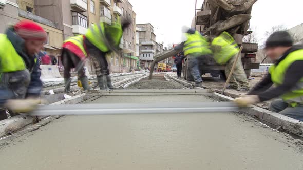 Pouring Readymixed Concrete After Placing Steel Reinforcement to Make the Road By Concrete Mixer