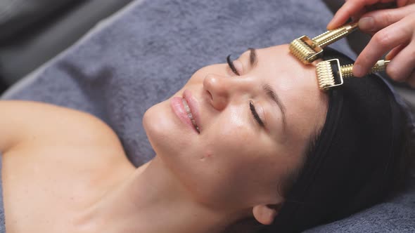 Cute Caucasian Woman Enjoys Getting Facials at the Spa