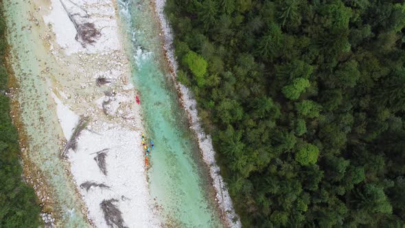 Aerial view of kayakers in the river Soca in Slovenia.