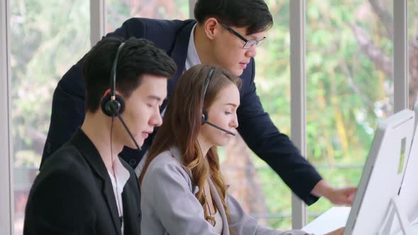 Business People Wearing Headset Working in Office