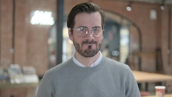 Portrait of Young Man Shaking Head As No Sign Denial