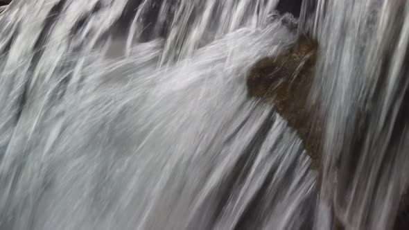 Flowing clear river water stream. Rapid river with water fall