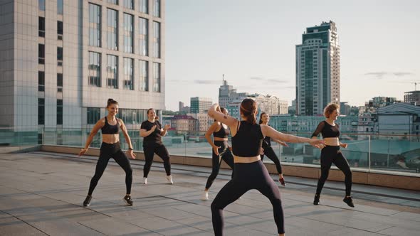 Beautiful Woman Learning Dancing with Female Instructor