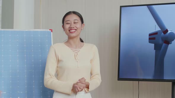 Woman Engineer With Solar Cell Succeed Presenting About The Wind Turbine Before Clapping Her Hands