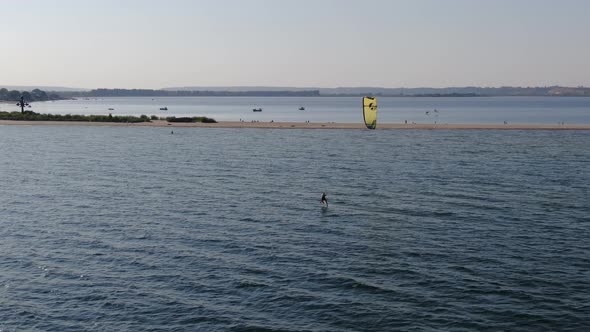 Aerial view of a man kitesurfing on the sea