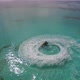 Aerial view of man racing water scooter on turquoise crystal clear water of the ocean in Maldives - VideoHive Item for Sale