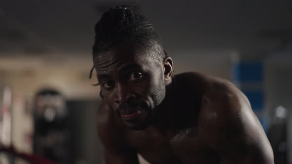 Closeup Exhausted Tired Sportsman Breathing Standing in Gym Looking at Camera